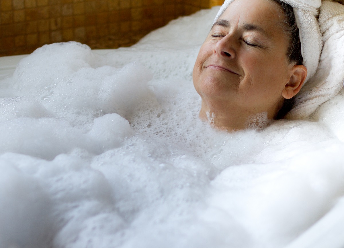 woman relaxing in the tub