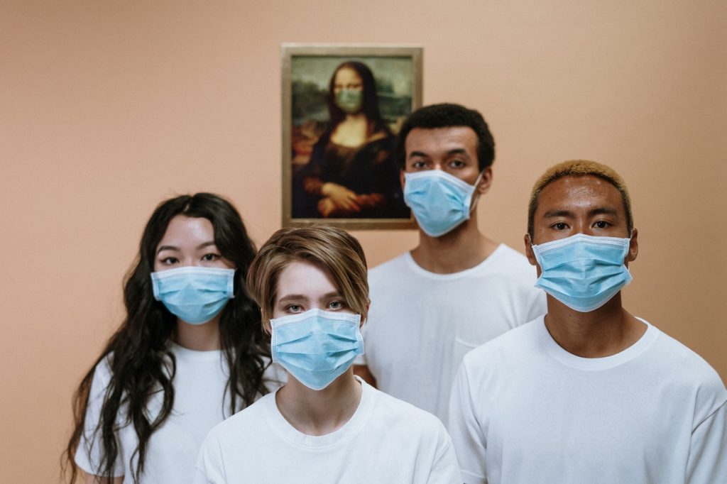a group of people wearing a face mask