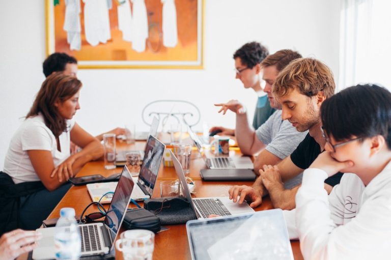 people huddled at a table