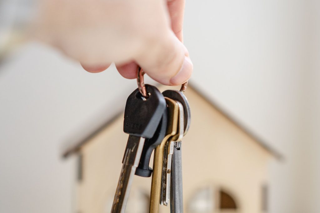 Person with keys for real estate