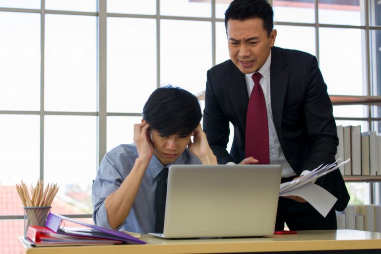 employee being scolder by his supervisor