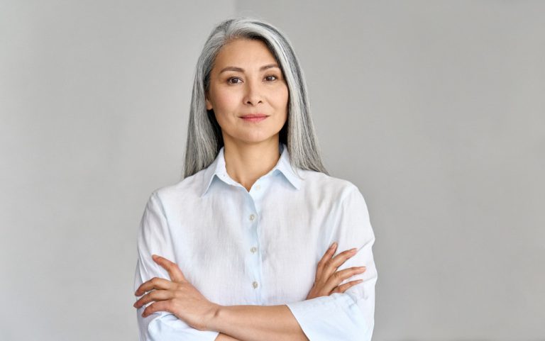 A strong and confident businesswoman with gray hair