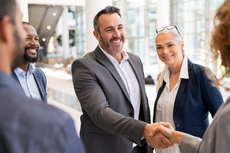 a businessman shaking hands with a client